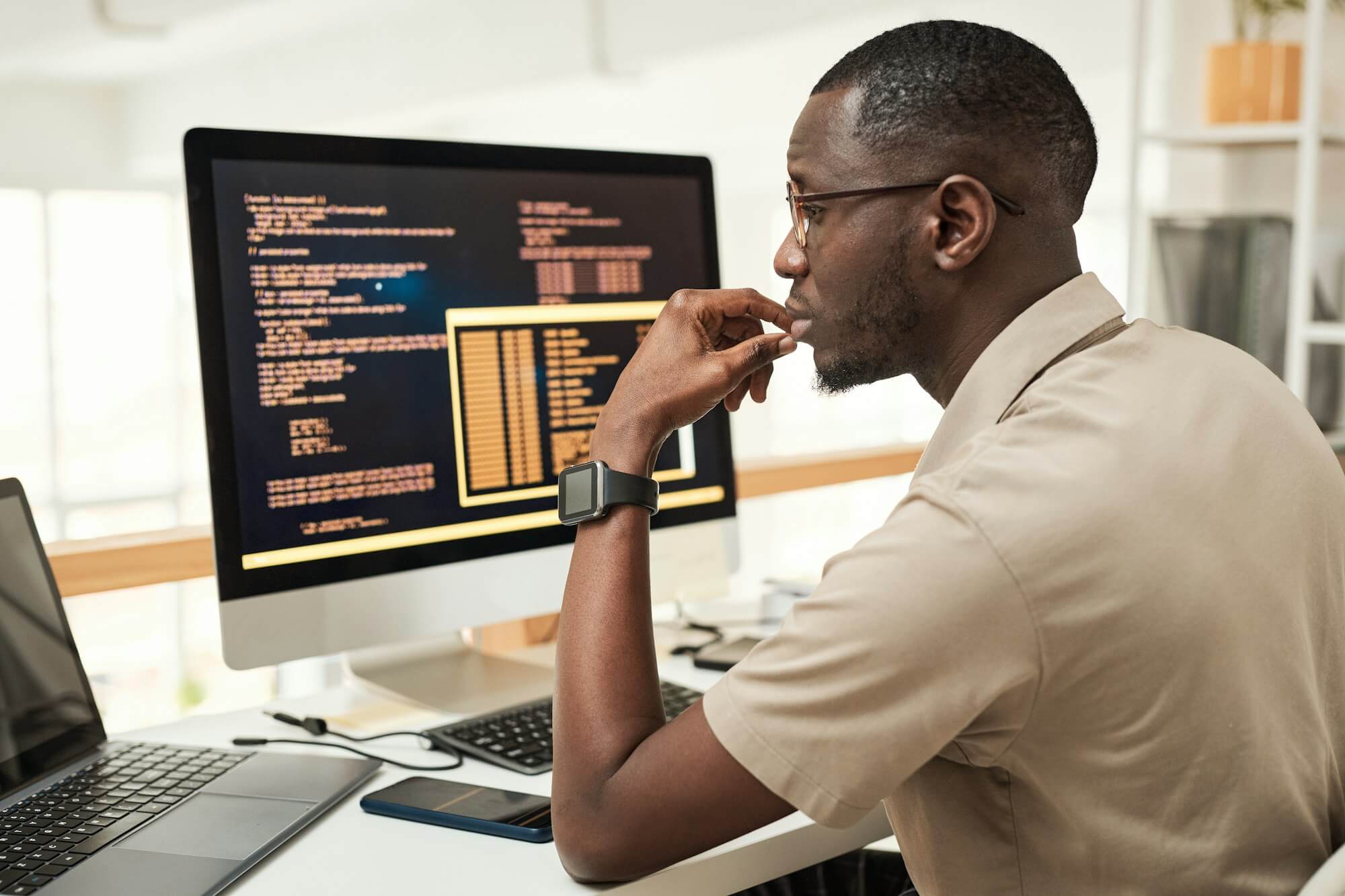 Software engineer reading programming code, preparing for Business Analyst roles